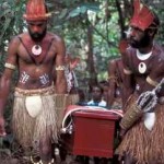 Young warriors from Eddie Mabo's Piadram clan carry his casket through the bamboo forest on Mer. Photo by Merrill Findlay, 1995.